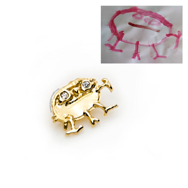 ZŁOTA ZAWIESZKA Z RYSUNKU DZIECKA - GŁOWONÓG Z BRYLANTAMI  W OCZACH